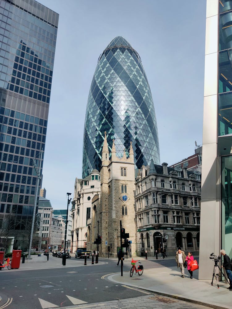 

A View Of The 30 St Mary Axe Building And The Saint Andrew Undershaft Church In London