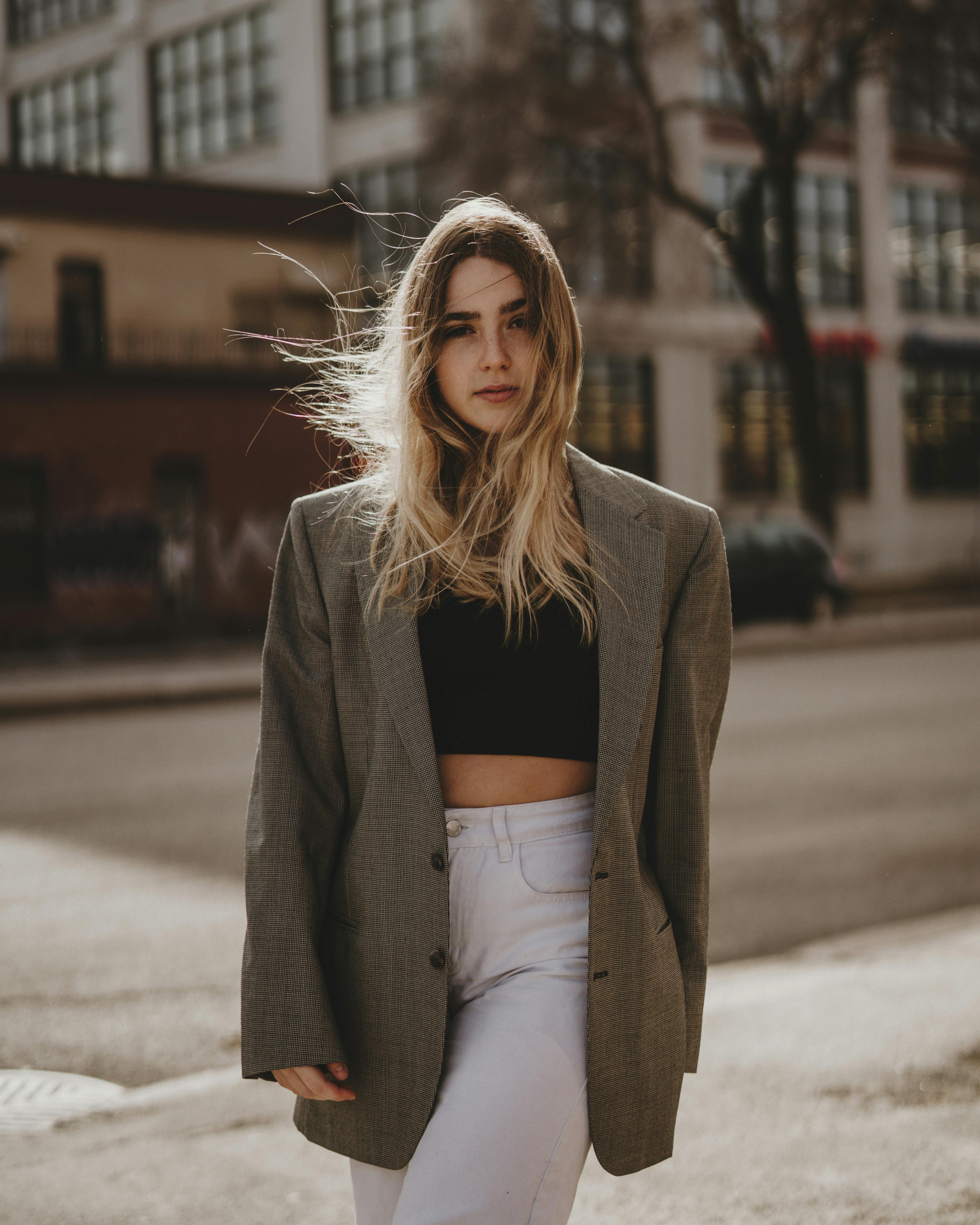 A Woman Wearing a Crop Top under a Blazer Free Stock Photo