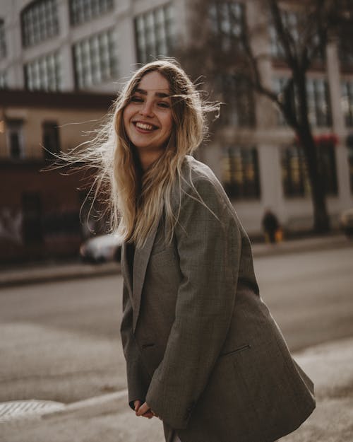 Portrait of Young Woman Smiling on a City Street