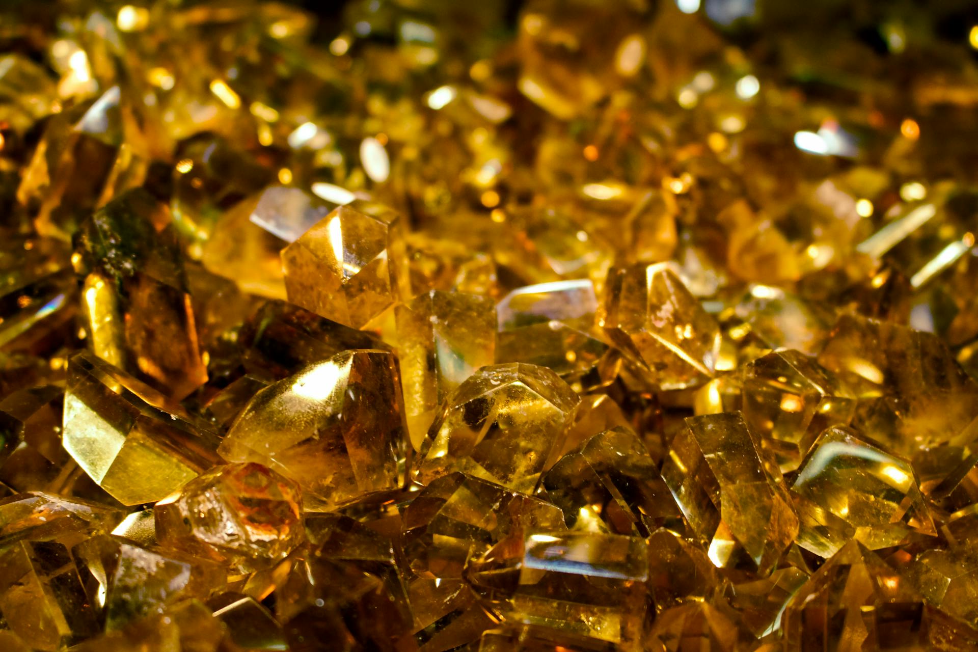 Close-up of shimmering golden crystals showcasing their intricate details and facets.