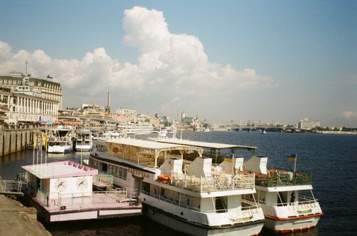 Free Riverboats docked at a picturesque marina in Kyiv, Ukraine on a sunny day. Stock Photo