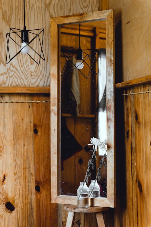 White Flower Beside the Wooden Framed Mirror 