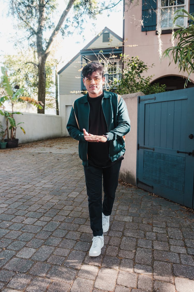 Man Walking Through Driveway