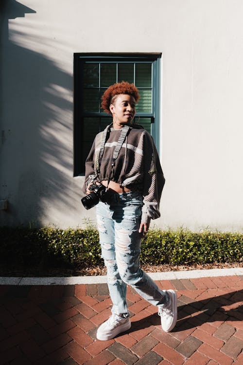 Female Photographer Posing with her Camera