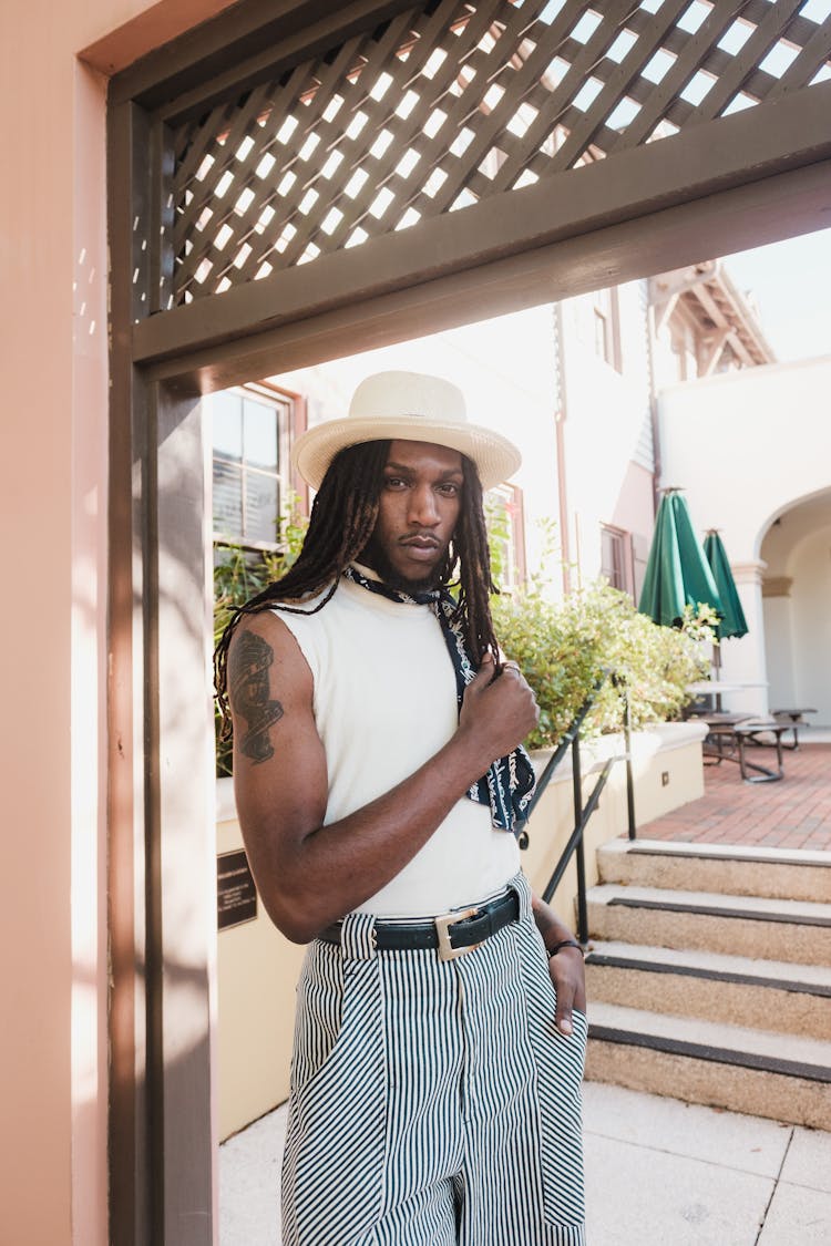 African American Man With Long Dreadlocks Wearing White Hat