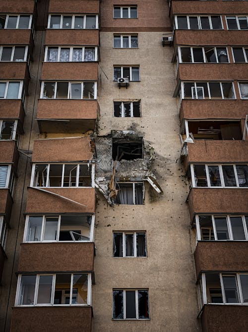 Apartament Building with a Damaged Window 