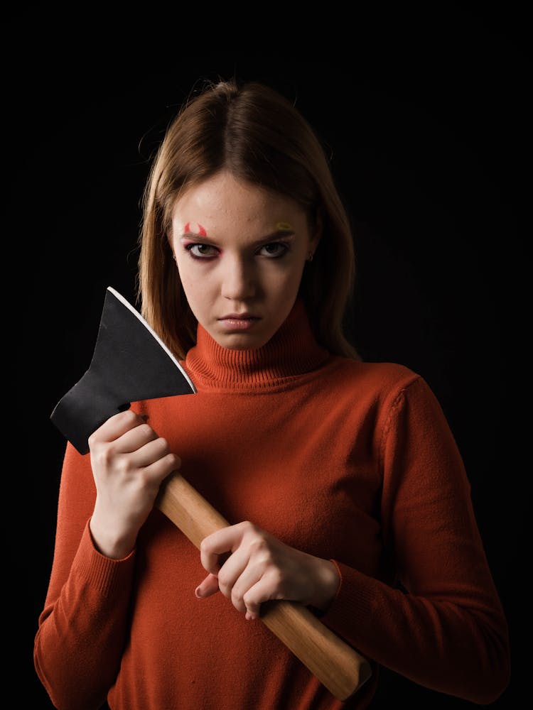 A Woman Holding An Axe