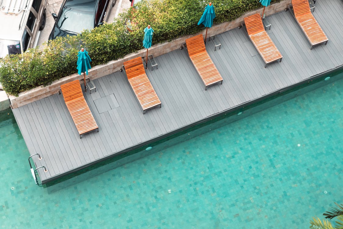 Free Swimming Pool with Sun Chairs Stock Photo