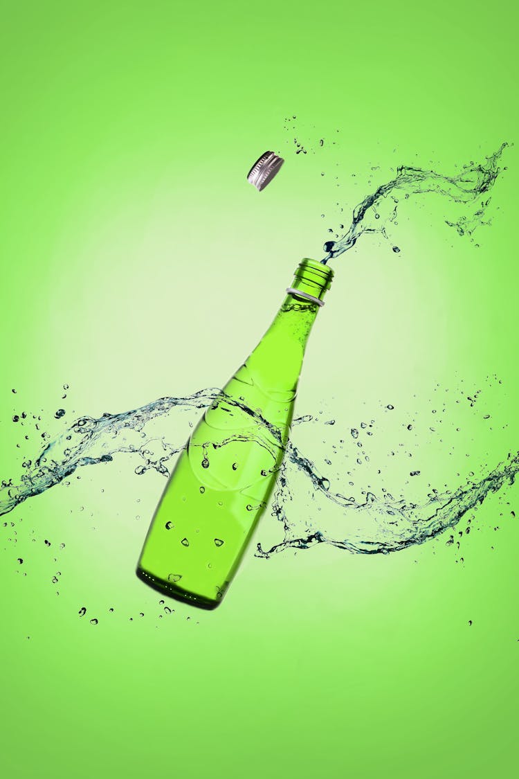 Green Glass Bottle With Water Splash