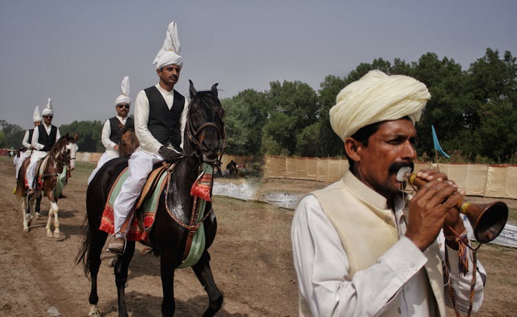 Men In Traditional Clothing Having A Parade