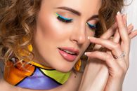 Woman Wearing Blue and Yellow Eyeliner