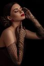 Elegant Woman Posing and Wearing Sheer Black Over-the-elbow Gloves 