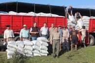 Group of Farmers beside a Red Truck