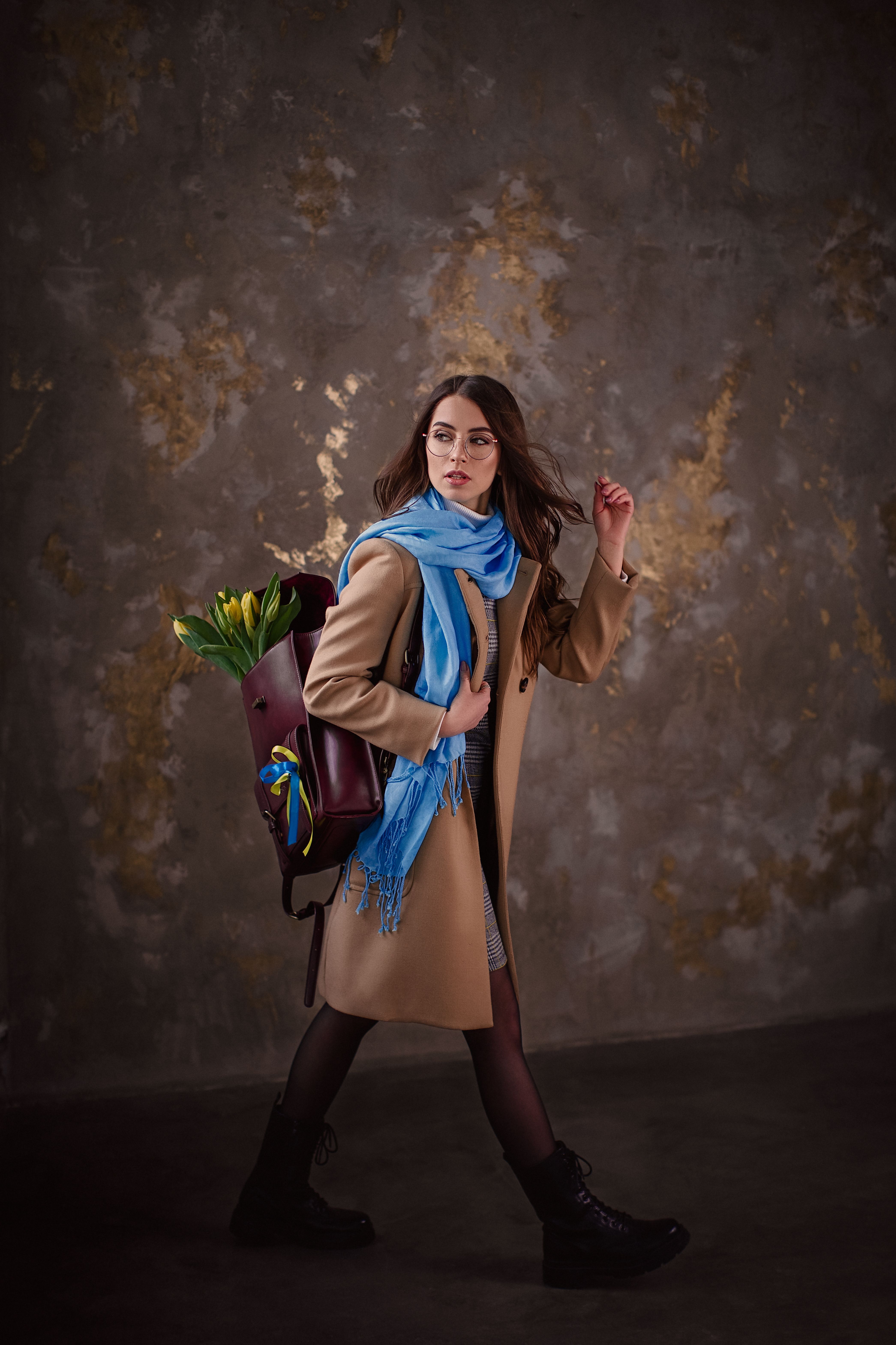 Photo of a Woman in Brown Coat Walking · Free Stock Photo