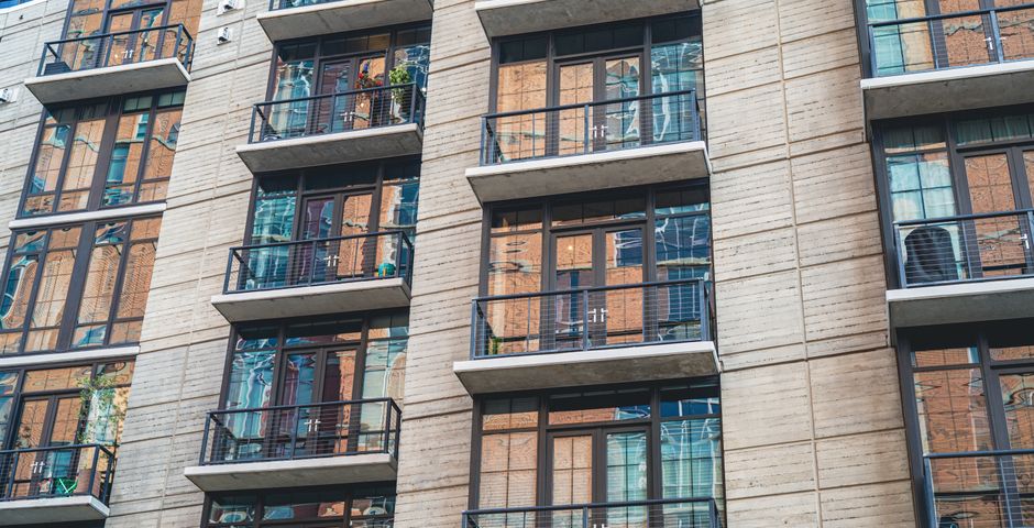 A modern apartment building — structural and building-wide pest issues are typically the owner's responsibility