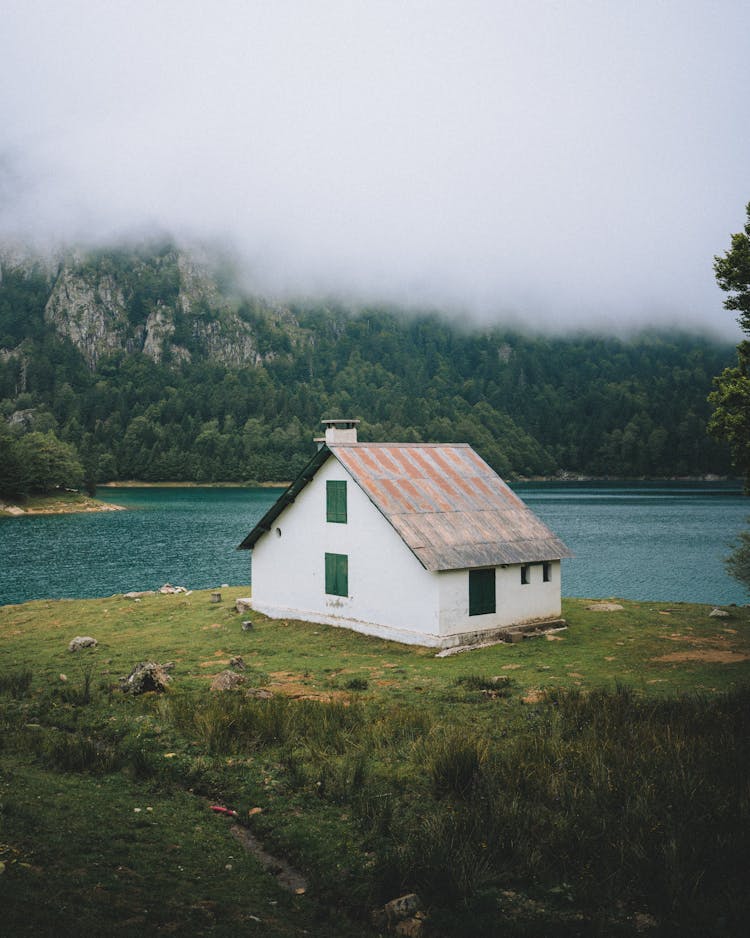 White House Next To A Lake At The Edge Of A Forest