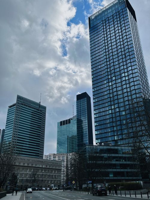 Free Glass skyscrapers dominate Warsaw's skyline, showcasing modern architectural design. Stock Photo