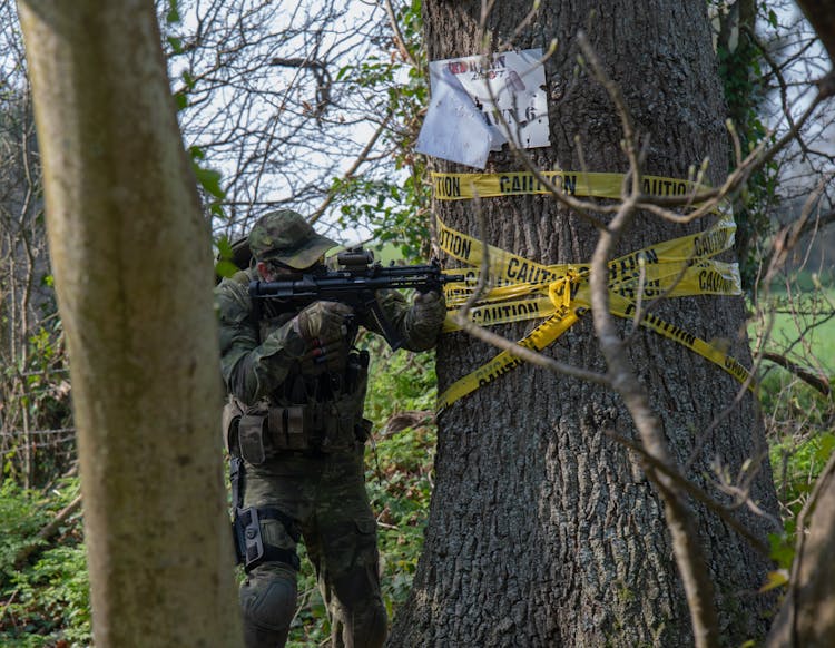 A Man Aiming His Airsoft Gun