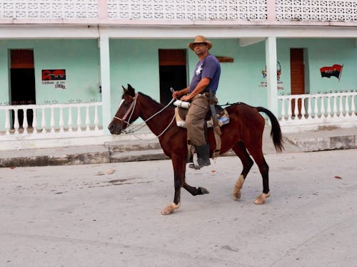 Photo of a Man Riding a Horse