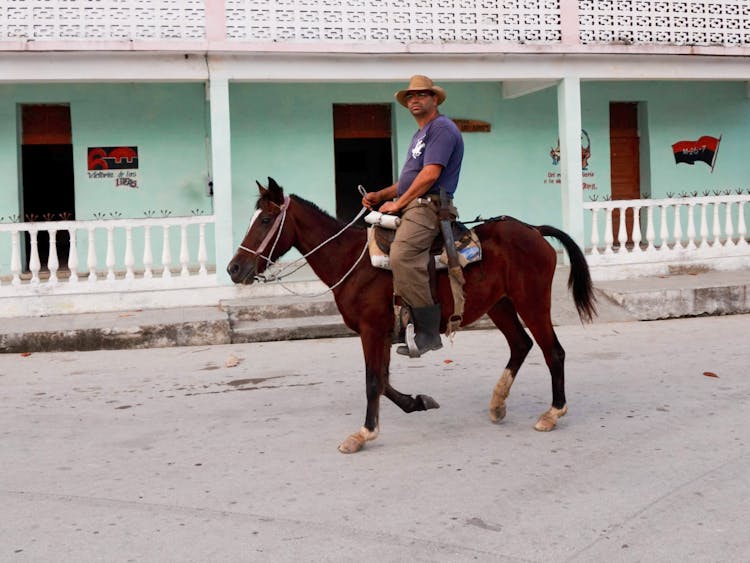 Photo Of A Man Riding A Horse