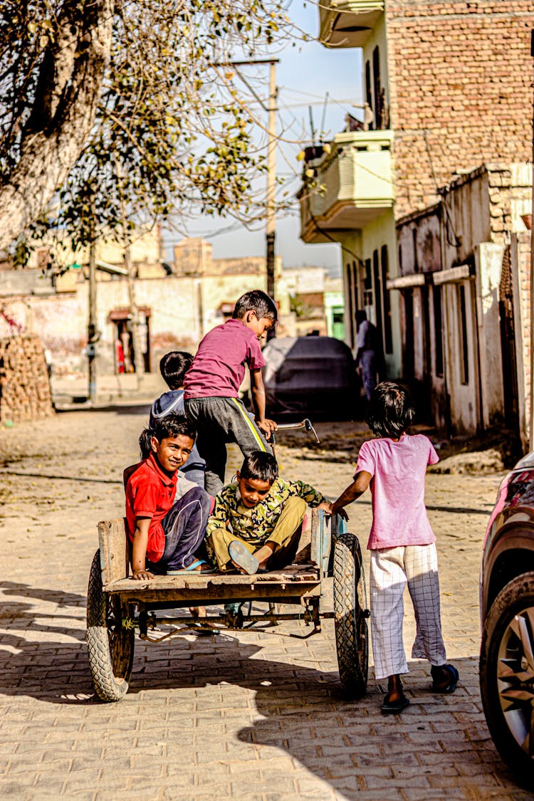 Boys On Bicycle With Trailer