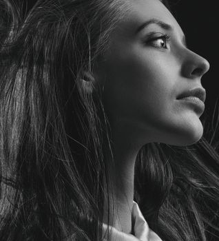 Stunning grayscale portrait capturing an elegant woman's side profile view in Kyiv.