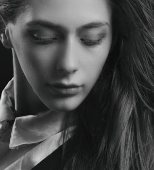 Stunning monochrome portrait capturing the elegance and emotion of a young woman.