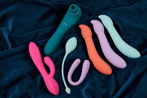 Free Sex Toys on a Blue Fabric Stock Photo