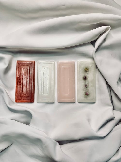 Assorted Bar Soaps on White Fabric 