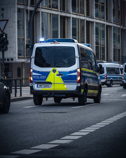 Free Blue and White Van on Road Stock Photo