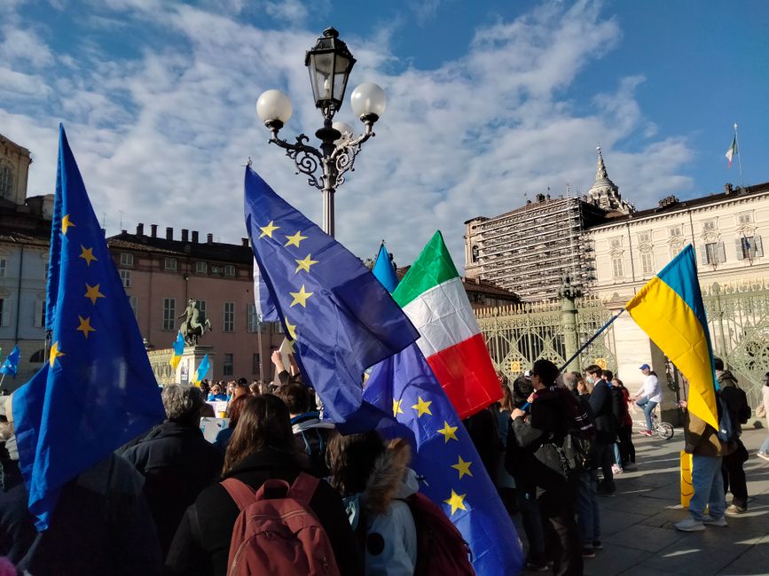 Protesters with European Union and national flags gather peacefully in Turin, Italy.