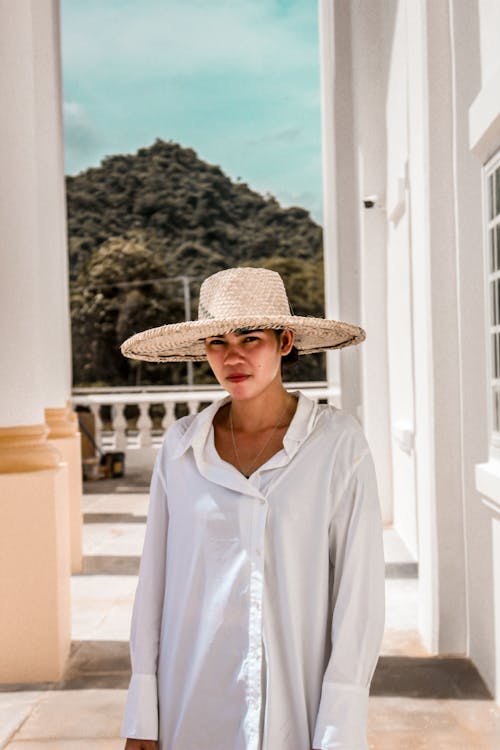 Free Woman in White Dress Shirt Wearing Brown Straw Hat Stock Photo