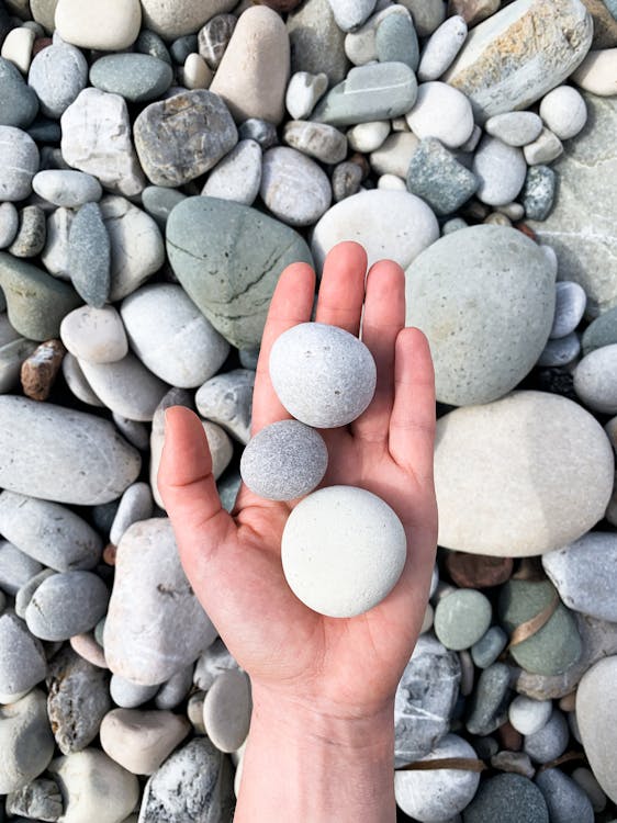 Holding Round Stones