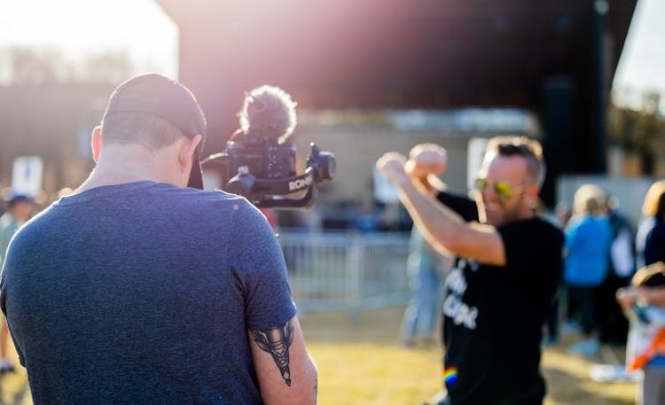 Back Of A Man Filming A Concert