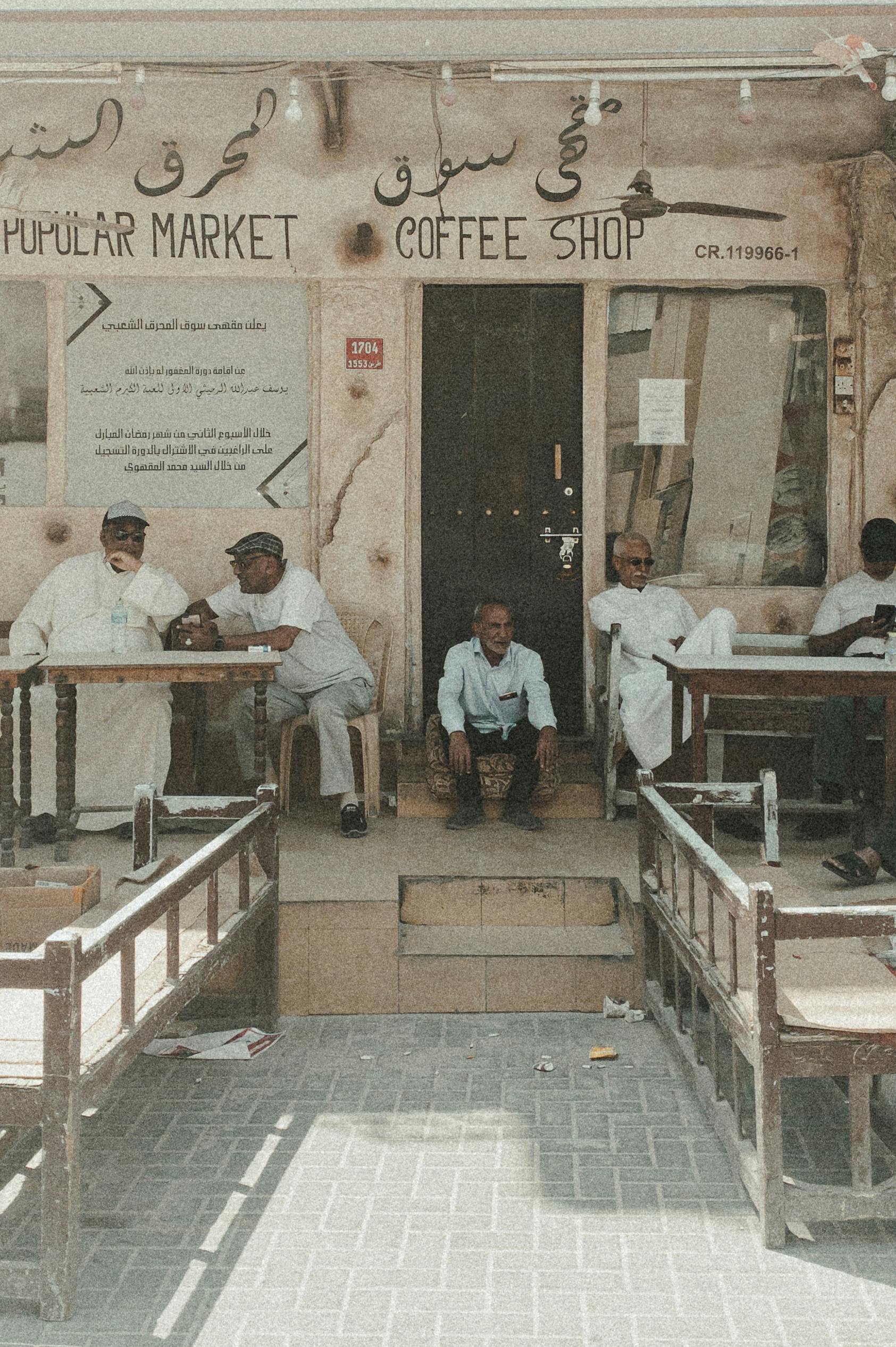 people in front of a coffee shop