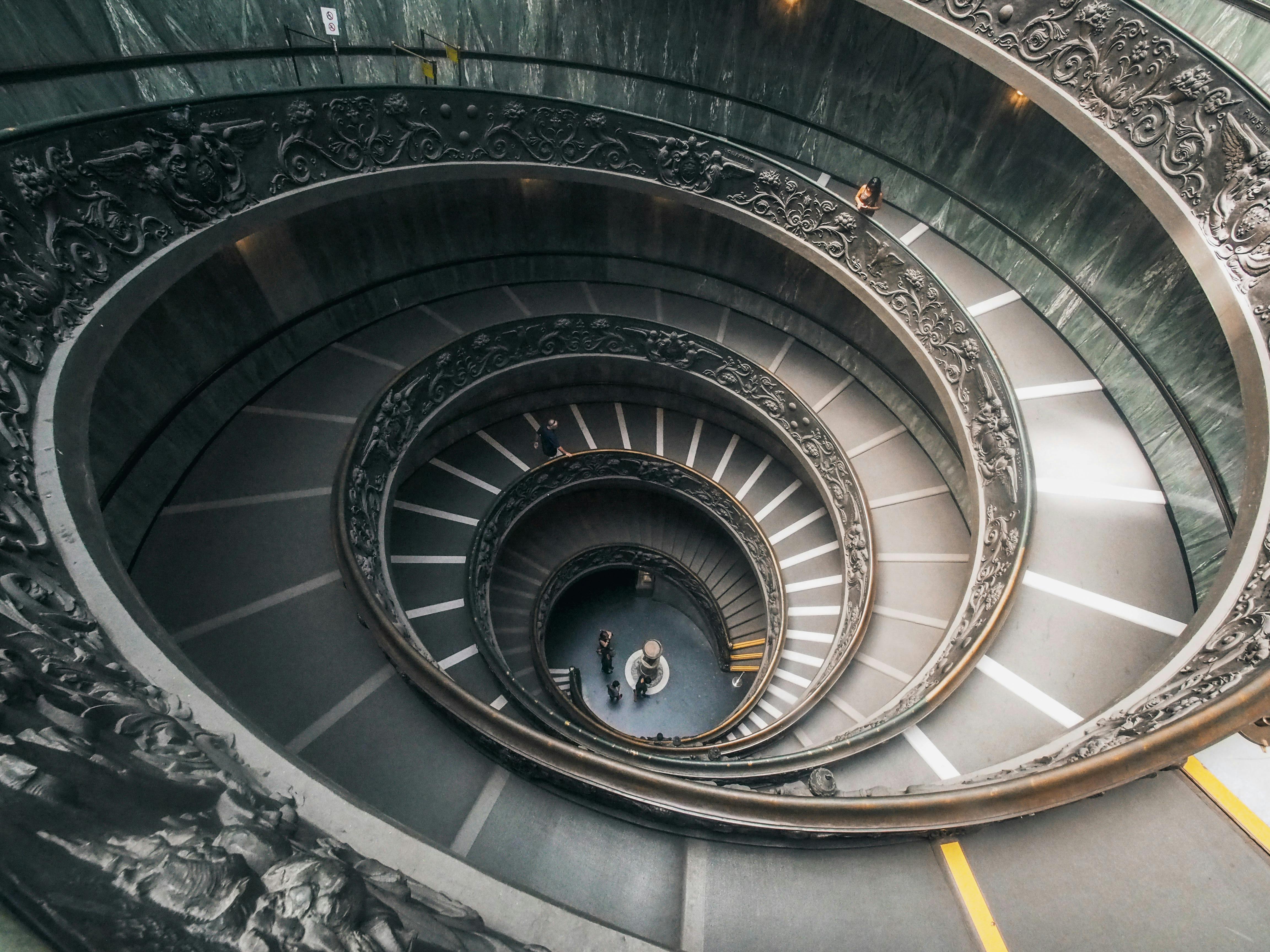 Spiral marble staircase inside a Cheongdam cafe with high ceilings