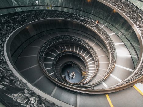 Black Spiral Staircase With Gray Concrete Staircase