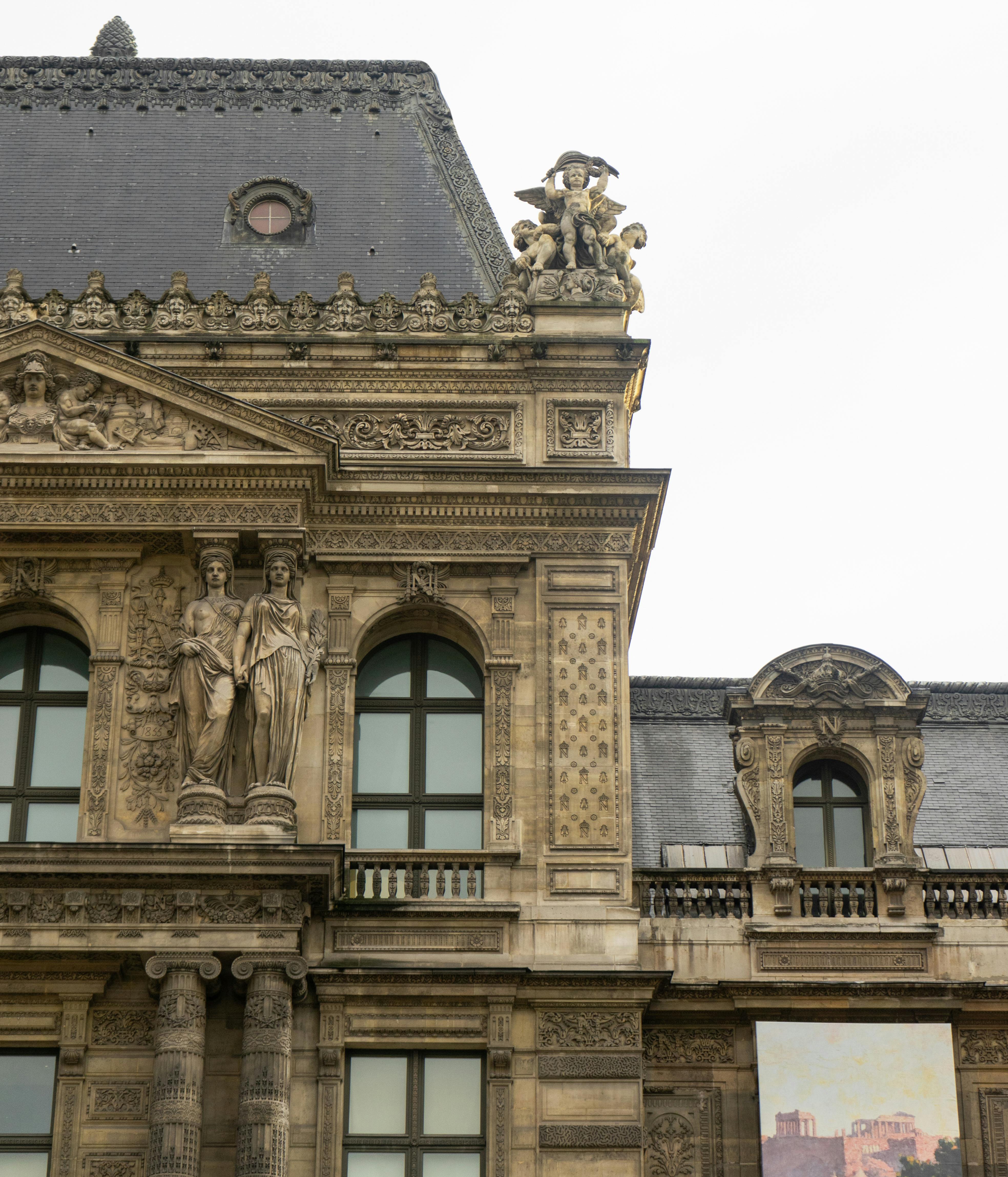 low angle shot of a historical building with sculptures