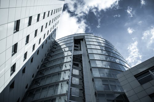 Low-Angle Shot of a High Rise Building under the Cloudy Sky