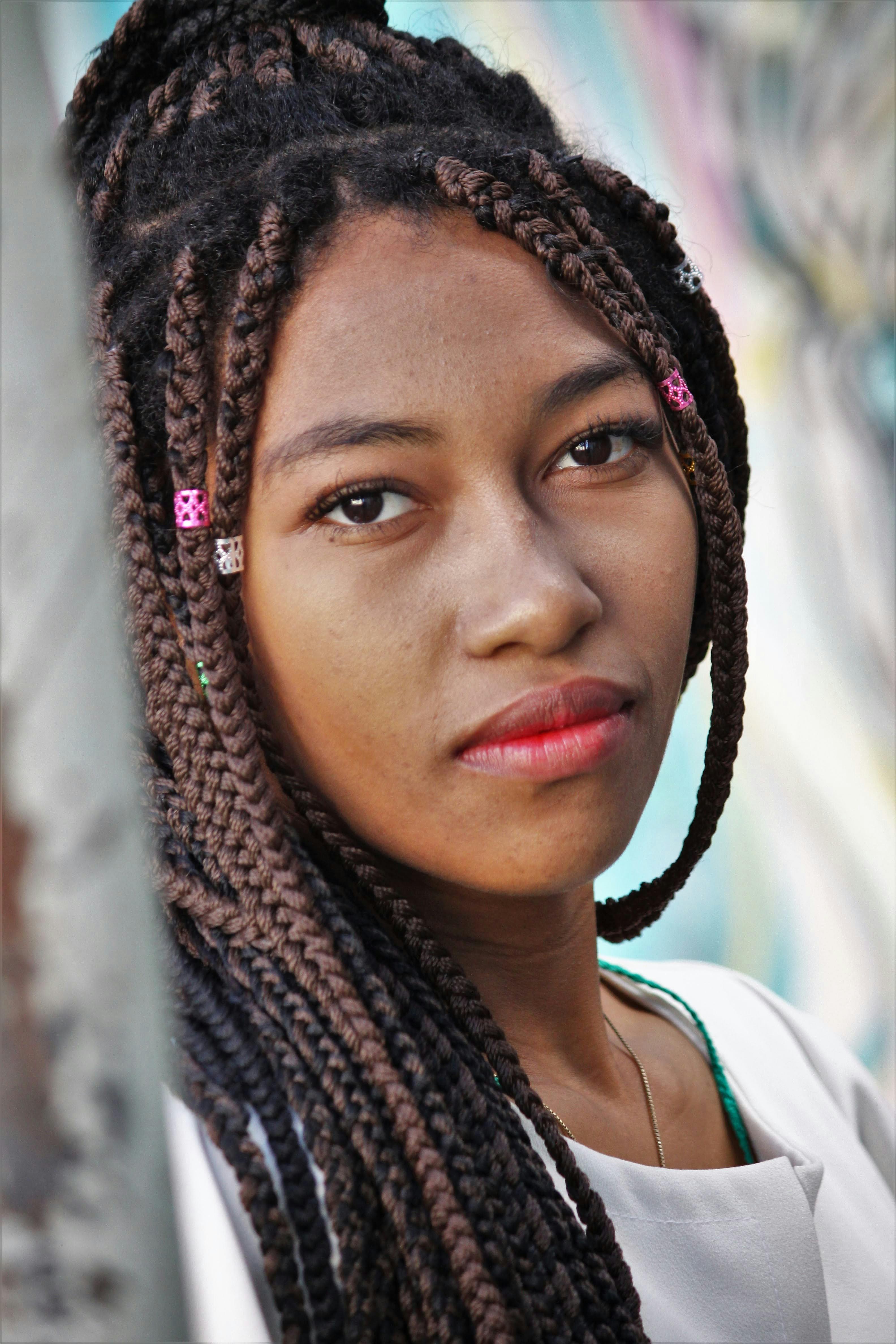 close up photo of a woman with braided hair