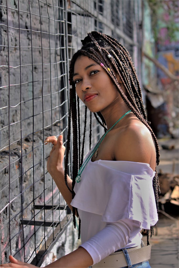 Cute Girl With Braid Pigtails Posing In Backyard