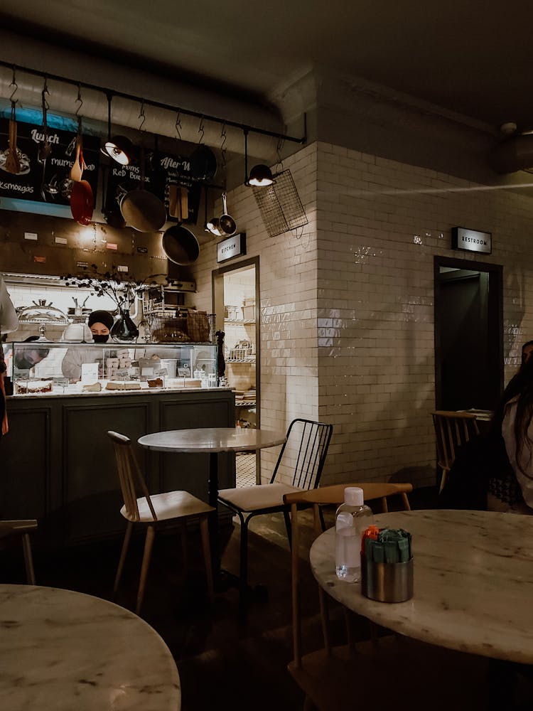 Woman Behind Restaurant Counter