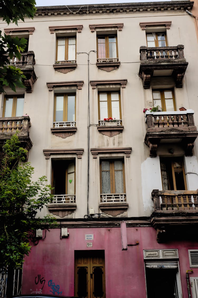 An Apartment Building With Balconies 