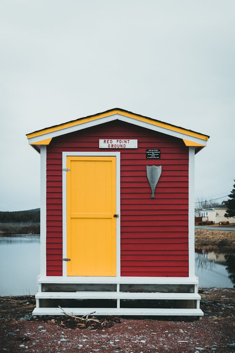 Red Beach House With Yellow Door