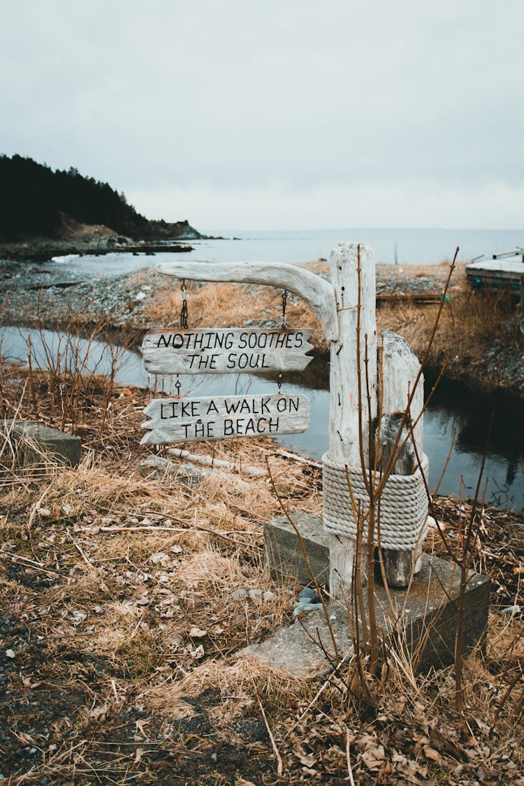 Sign With Text On Beach