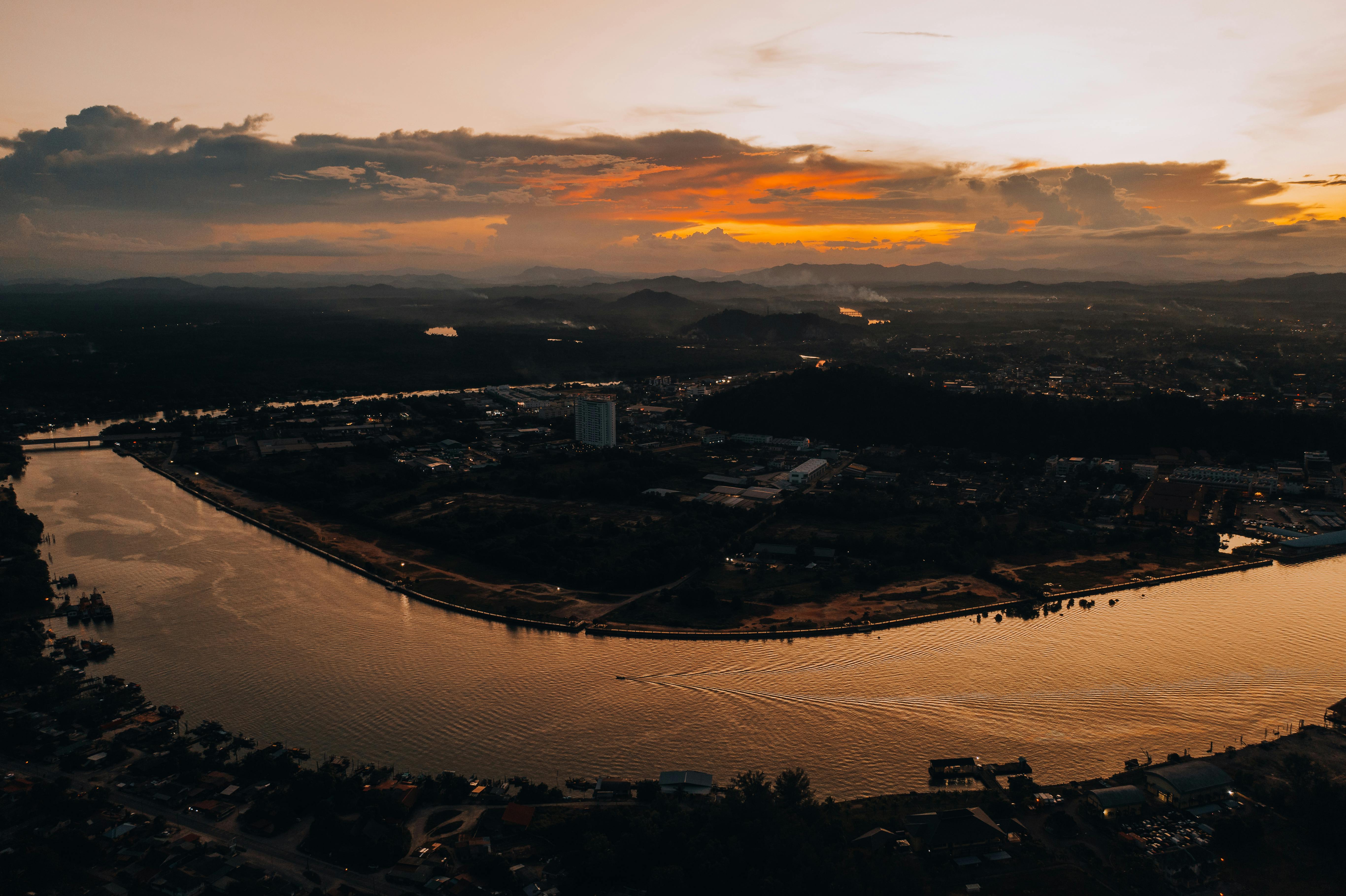 aerial view of city near river during dusk