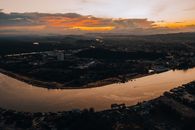 Aerial View of City near River during Dusk