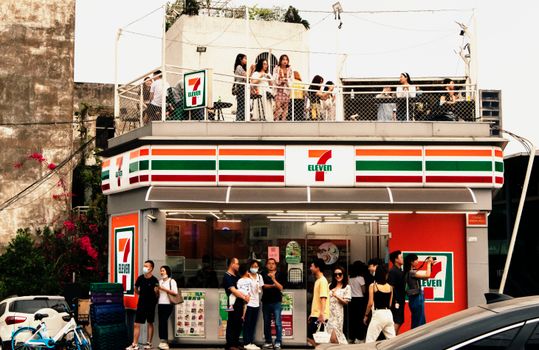 People In Front of a Convenience Store