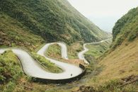Curved Road between Mountains