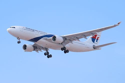 Free Malaysia Airlines Airplane Flying in the Sky Stock Photo